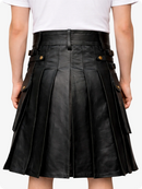 Black leather skirt worn by a person on a white background