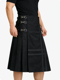 Black skirt with belt details worn by a person on a white background