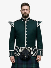 Man wearing a dark green doublet jacket with white trim and a black watch tartan kilt on a white background