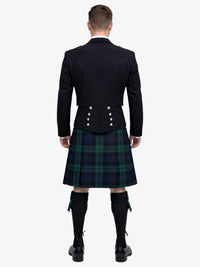 Man wearing a black prince charlie jacket and black watch tartan plaid kilt on a white background