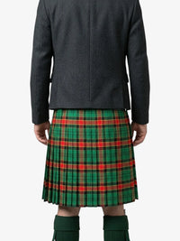 Person wearing a green plaid kilt on a white background
