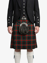 Person wearing a traditional Scottish kilt with a tartan pattern on a white background