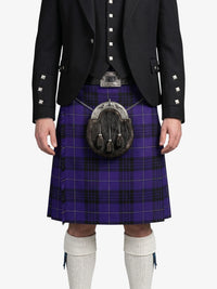 Person wearing a black jacket, purple plaid kilt, and white knee-high socks on a white background