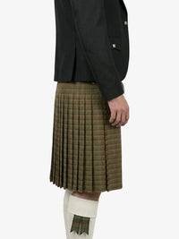 Person wearing a black jacket and plaid kilt on a white background
