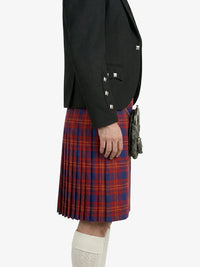 Person wearing a black blazer and red plaid kilt on a white background