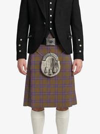 Person wearing a traditional Scottish kilt with a white background