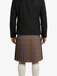 Person wearing a black jacket and plaid kilt on a white background