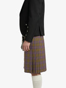 Person wearing a black jacket and plaid kilt on a white background