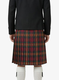 Person wearing a black jacket and red plaid kilt on a white background