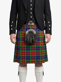 Person wearing a traditional Scottish kilt with a tartan pattern on a white background