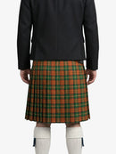 Person wearing a black jacket and green plaid kilt on a white background