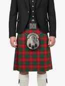 Person wearing a red and green plaid kilt with a black jacket on a white background