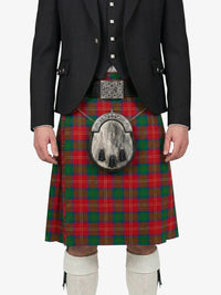Person wearing a red and green plaid kilt with a black jacket on a white background