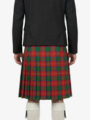 Person wearing a black jacket and red plaid kilt on a white background