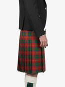 Person wearing a black jacket and red plaid kilt on a white background