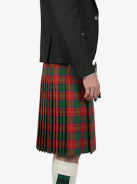Person wearing a black jacket and red plaid kilt on a white background