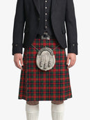 Person wearing a black jacket, red plaid kilt, and white knee-high socks on a white background