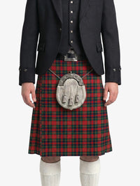 Person wearing a black jacket, red plaid kilt, and white knee-high socks on a white background