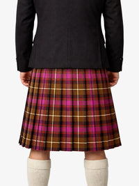Person wearing a black jacket and plaid kilt on a white background
