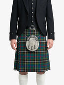 Person wearing a black suit with a green plaid kilt on a white background
