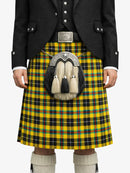 Person wearing a traditional Scottish kilt with a tartan pattern on a white background