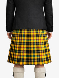 Person wearing a black jacket and yellow plaid kilt on a white background