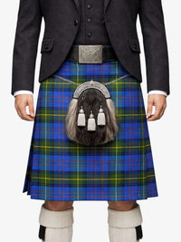 Person wearing a traditional Scottish kilt with a tartan pattern on a white background