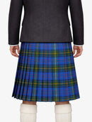 Person wearing a dark jacket and blue plaid kilt on a white background