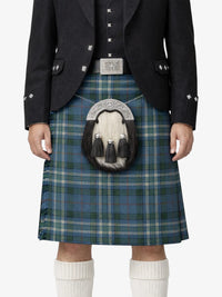 Person wearing a traditional Scottish kilt with a sporran on a white background