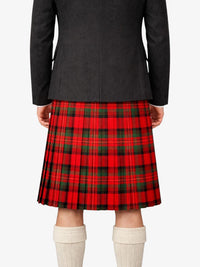 Person wearing a black jacket and red plaid kilt on a white background