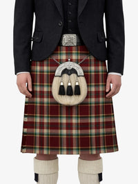 Person wearing a red plaid kilt with a matching jacket on a white background
