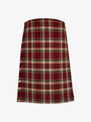 Plaid kilt with red, green, and beige pattern on a white background