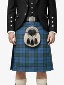 Person wearing a traditional Scottish kilt with a jacket and sporran on a white background