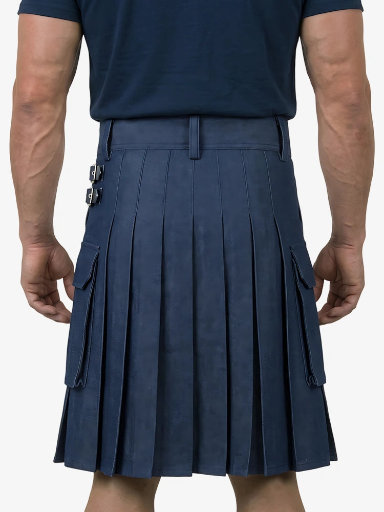 Person wearing a navy pleated kilt on a white background