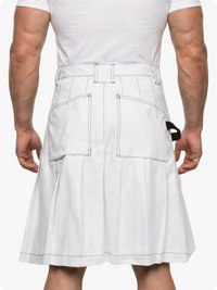 Person wearing a white kilt on a plain background