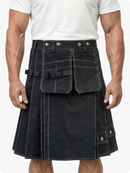 Black kilt with multiple pockets worn by a person on a white background