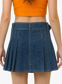 Blue pleated skirt worn by a person on a white background