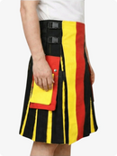 Person wearing a colorful striped kilt with black, red, and yellow stripes on a white background.