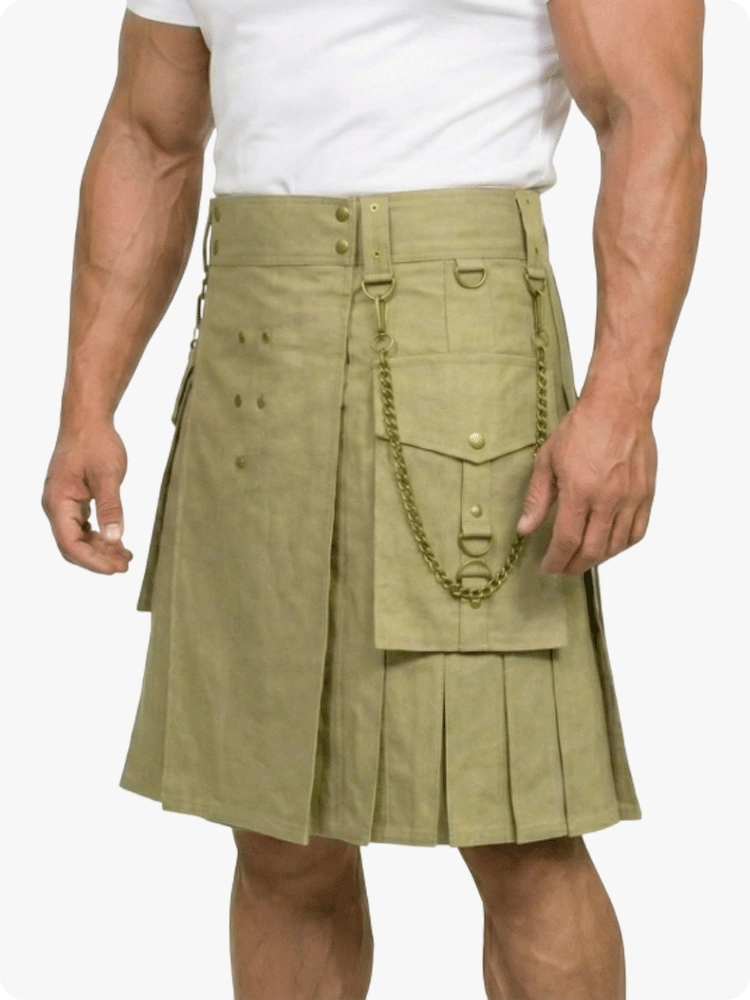 Person wearing a green kilt with a white shirt on a plain background