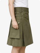Green kilt worn by a person on a white background