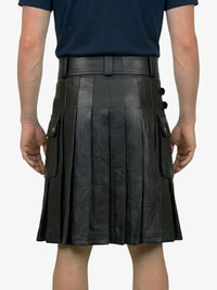 Person wearing a black leather kilt on a white background
