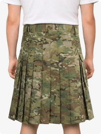 Camouflage pleated skirt worn by a person on a white background