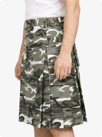 Camouflage patterned skirt worn by a person on a white background