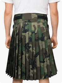 Camouflage pleated skirt worn by a person on a white background