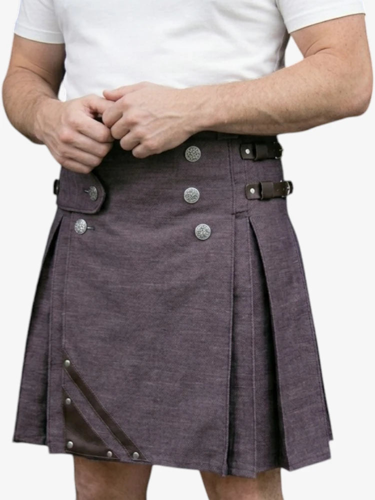 Person wearing a purple kilt with silver buttons on a white background