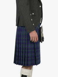 Person wearing a gray jacket and a purple plaid kilt on a white background