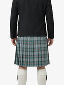 Person wearing a black jacket and plaid kilt on a white background