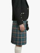 Person wearing a black jacket and blue plaid kilt on a white background