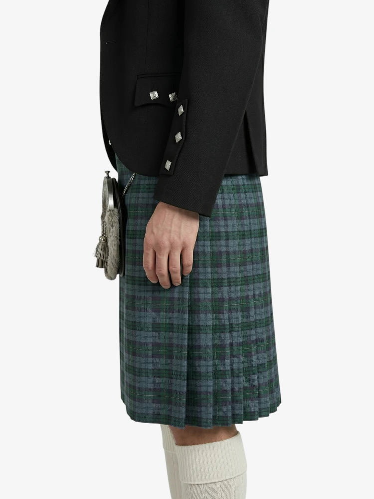 Person wearing a black jacket and green plaid kilt on a white background