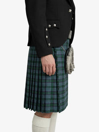 Person wearing a black jacket and green plaid kilt on a white background